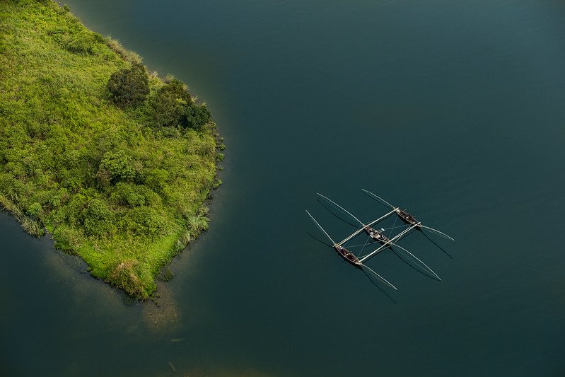 Aerial of traditional outrigger fishing boats in Lake Kivu, Rwanda