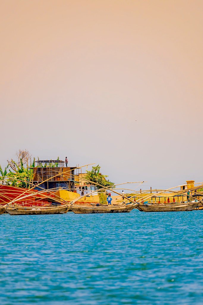 Wooden fishing boats moored along shore in Lake Kivu, Rwanda