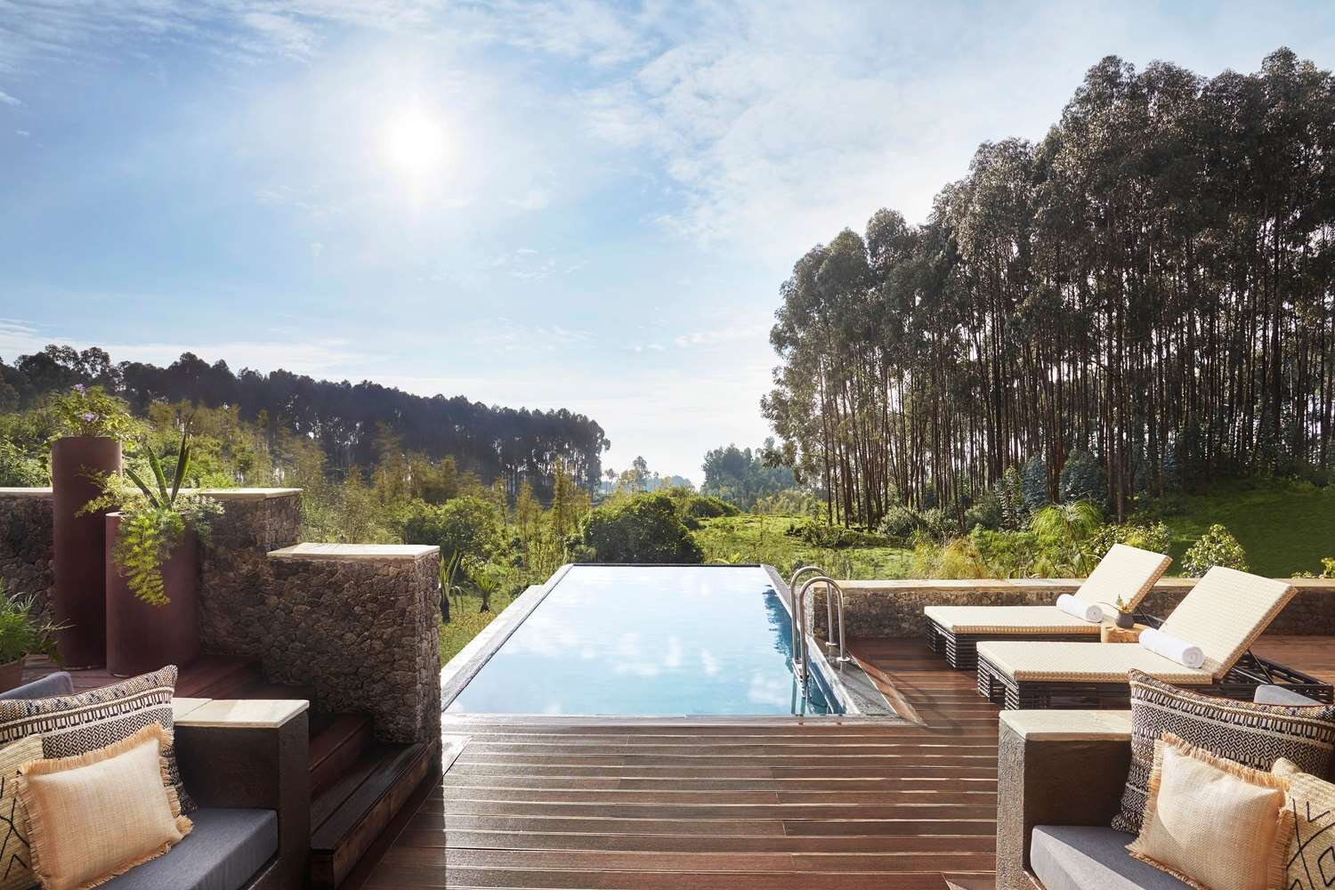 Lodge infinity pool and sun loungers in Volcanoes, Rwanda